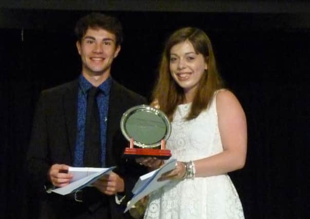 Our Lady of Sion School students Robert Montague and Laura Reed receive their awards at the prizegiving ceremony