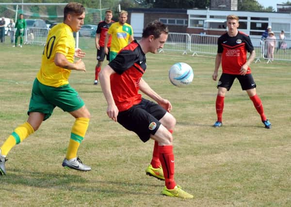 Sidlesham in recent action against Lancing / Picture by Kate Shemilt