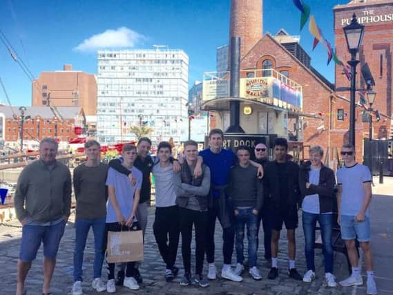 The Hastings United academy squad enjoy some time in the Albert Dock area of Liverpool