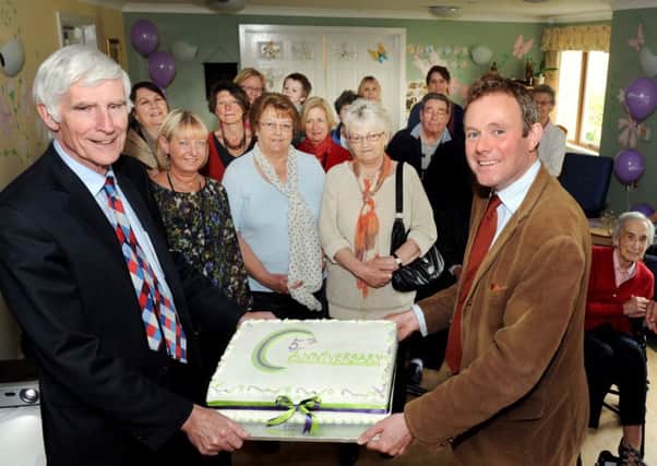 Chief executive of Shaw Healthcare  Jeremy Nixey, left, with MP Nick Herbert help Rotherlead with its fifth birthday celebrations in 2013