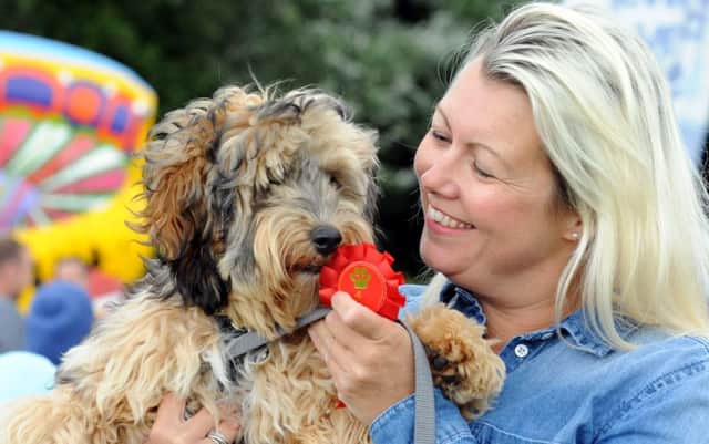 Claire Bolton with her dog Gus who won 'Best Puppy' and 'Best in Show'