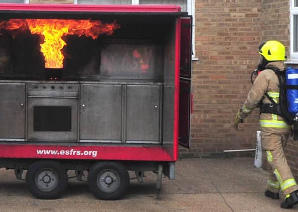 Bexhill Fire Station open day in 2014.  How not to fight a chip-pan fire SUS-140920-183155001