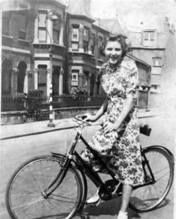 Edna Barnett cycling to work