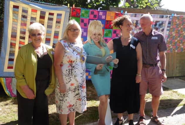 Annalise Elam, Hastings Mayor Judy Rogers, 'Dolly Parton',  Rotarians Chris Foley and Peter Cocker SUS-160921-140721001