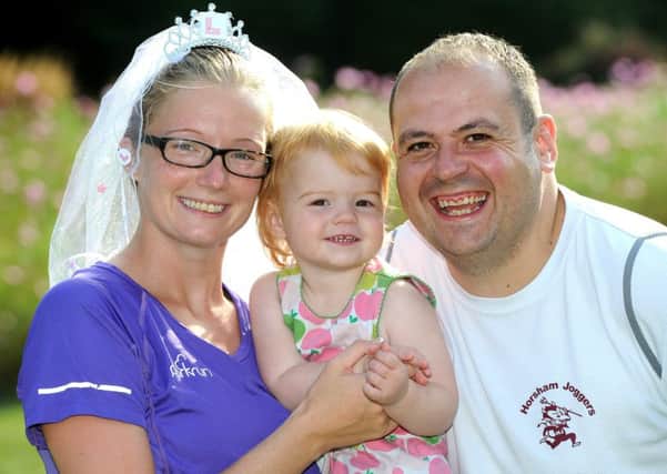 Gemma Berrill and future hubby Jon Berrill with baby Libby, 18 months. The couple are keen runners and took part in a parkrun on the morning of their wedding day. Pic Steve robards  SR1627001 SUS-160917-121549001