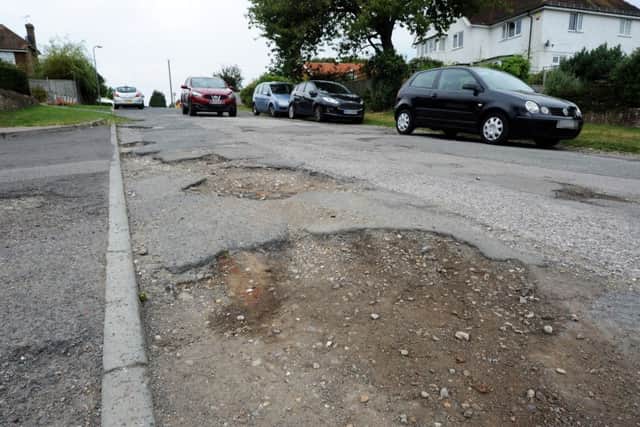 Road surface issues on the unadopted part of Penland Road, Bexhill. SUS-160919-153518001