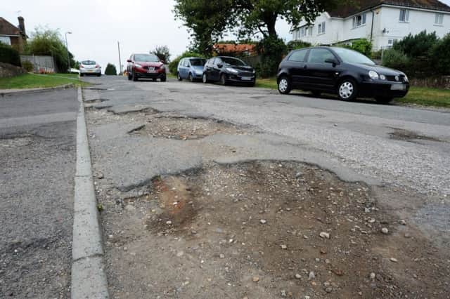 Road surface issues on the unadopted part of Penland Road, Bexhill. SUS-160919-153518001