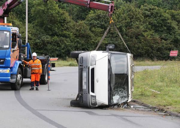 The van overturned at the A238 roundabout near the Shoreham flyover. Picture: Eddie Mitchell SUS-160919-142328001