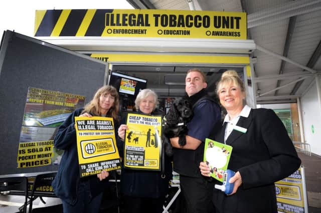 Illegal Tobacco Unit at Asda, St Leonards.  L-R Elizabeth Bowring and Lee Ede (Trading Standards Service), Stuart Phillips with Phoebe (B.W.Y Canine Specialist Search Dogs) and Julie Hunt (Quit 51). SUS-160509-120452001