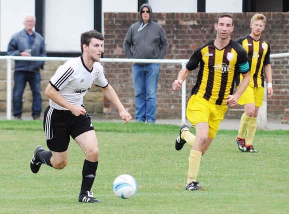 Connor Robertson on the ball for Bexhill United against Southwick. Picture courtesy Jon Smalldon