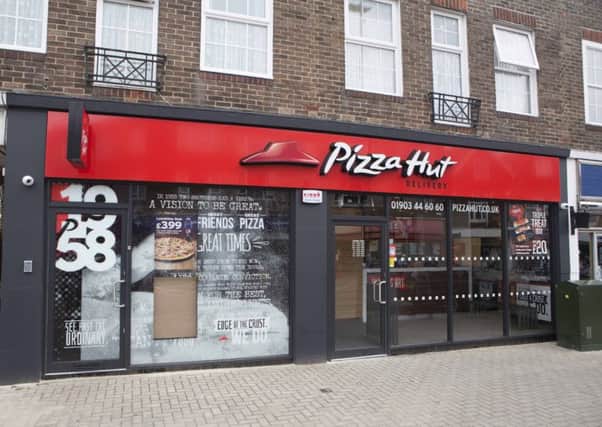 A man has been arrested in connection with an armed robbery at Pizza Hut in Lancing