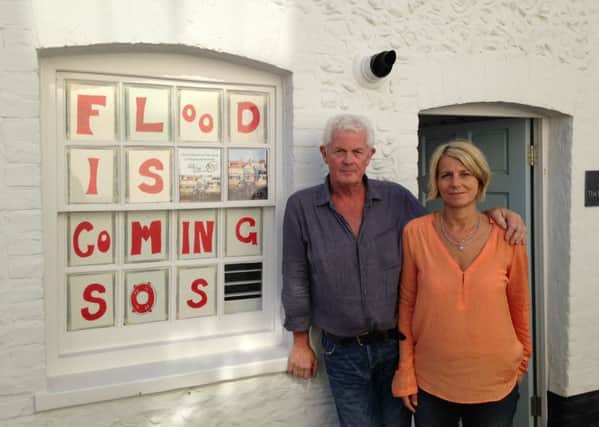 Johnny Boylan and Belinda Pickering outside their house in River Road