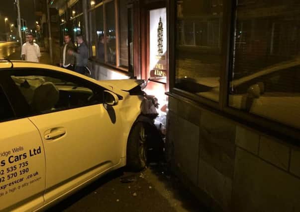 The taxi had collided with another car before the collision with the restaurant, according to the fire service