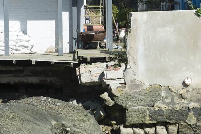 The extent of the damage to Johnny Boylan and Belinda Pickering's flood wall SUS-160914-173033001
