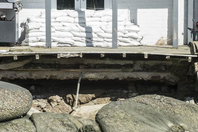 The extent of the damage to Johnny Boylan and Belinda Pickering's flood wall SUS-160914-173058001