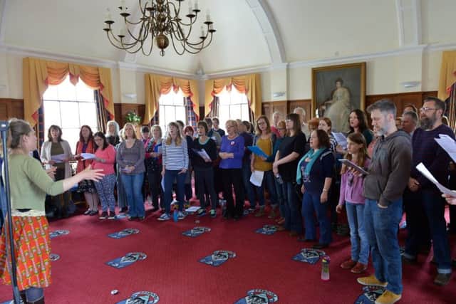 Emily Longhurst conducts Secret Shore singers at the recording day at Littlehampton Town Hall on April 23