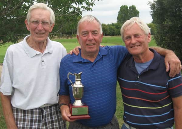 Mike Harrington with the Claret Jug, flanked by Maurice Hall and Bill Dunstone