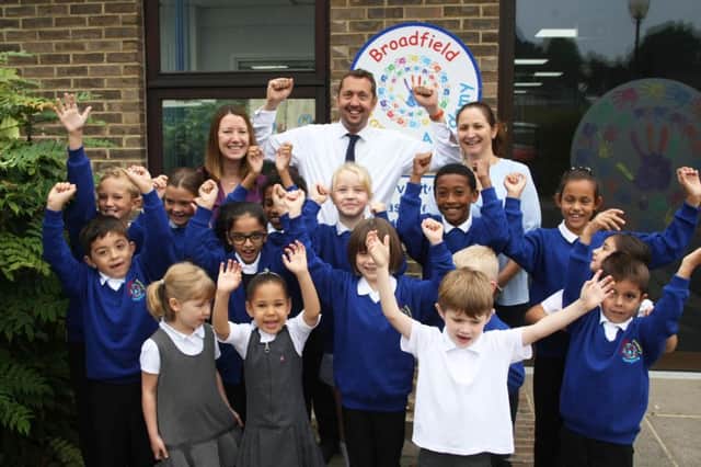 Headteacher David Tow, deputy heads Catherine Lewis and Sian Marham and pupils celebrate Broadfield Primary Academys  good Ofsted rating