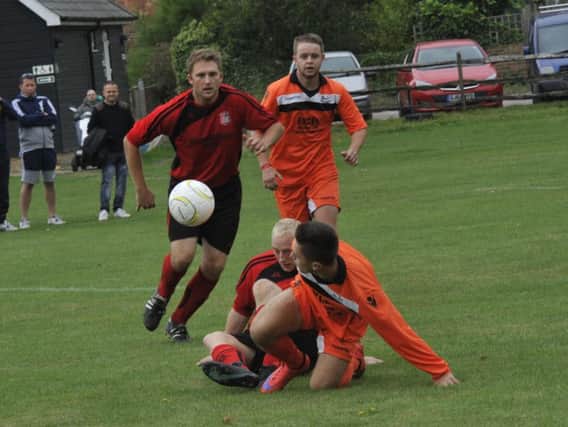Rye Town and The JC Tackleway scrap for possession at The Salts on Saturday. Picture by Simon Newstead