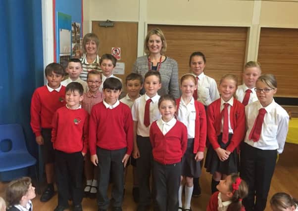 Ms Rudd and headteacher Paula Robinson pictured with pupils who asked questions