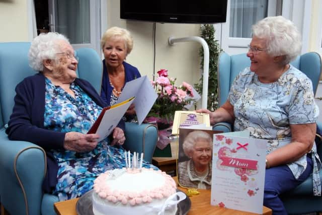 Carol Booth (left) and Brenda Forrester (right) with their mother Olive at Fernbank Care Home in Worthing