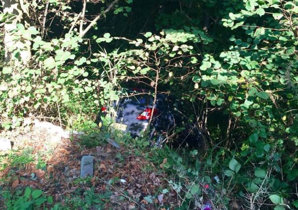 A Vauxhall Corsa ended up in a ditch after a crash on Gillsman's Hill, St Leonards. Photo by Martin Wilson SUS-160921-173612001