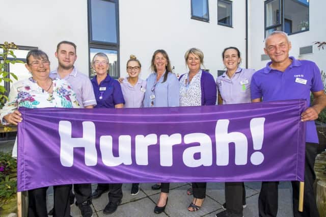 Staff celebrate the care home's rating