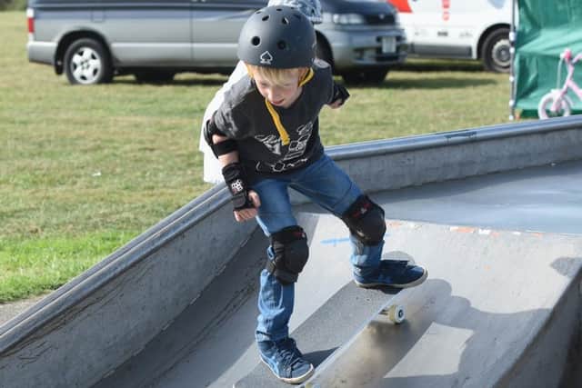 A skateboarder showing off his skills at the Angmering Skate Bowl and BMX Jam