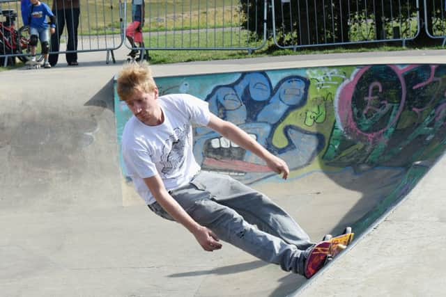 A skateboarder showing off his skills at the A BMX enthusiast showing off his skills at the Angmering Skate Bowl and BMX Jam
