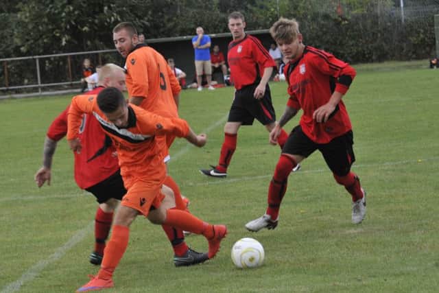 Midfield action from Rye Town's 2-0 win The JC Tackleway. Picture by Simon Newstead