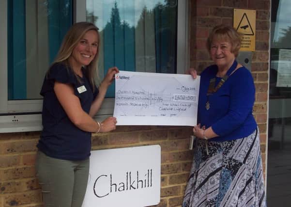 Chalkhill Matron Kate Stammers (left) receiving the cheque from Inner Wheel member Sally Dew.