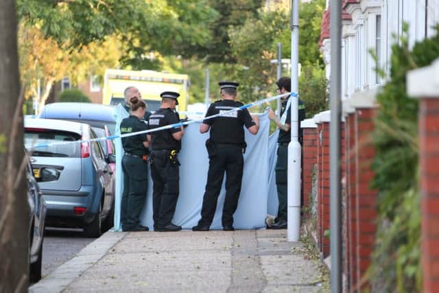 Police cover the man's body in Wordsworth Road this morning. Pictures by Eddie Mitchell