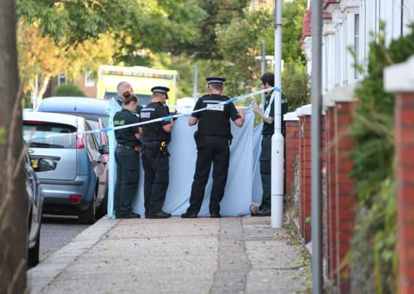 Police cover the man's body in Wordsworth Road this morning. Pictures by Eddie Mitchell