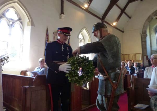 Lord Lieutenant of East Sussex Peter Field laid a wreath during the service, handed to him by Crowhurst Parish Council chairman Alan Stainsby in his Saxon warrior costume SUS-160926-172758001