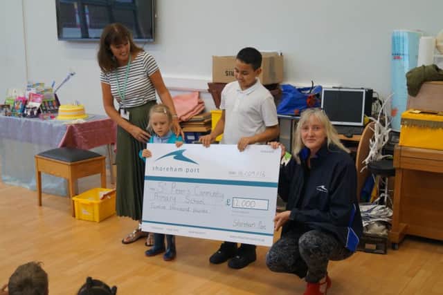 Shoreham Port presents a cheque for Â£12,000 to the school