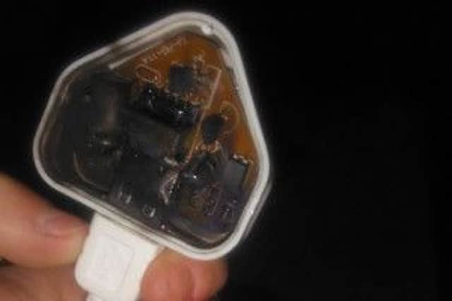 The charred plug of the lead bought to charge a Samsung S5. ANL-160922-173428001