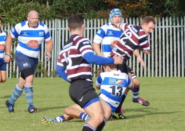Hastings & Bexhill on the defensive during their victory over Beccehamian.