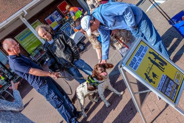 Roger Cohen with sniffer dog George and visitors to the event in Bexhill