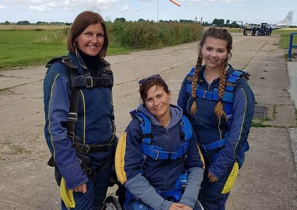 Amanda after completing a tandem skydive with her eldest daughter and friend