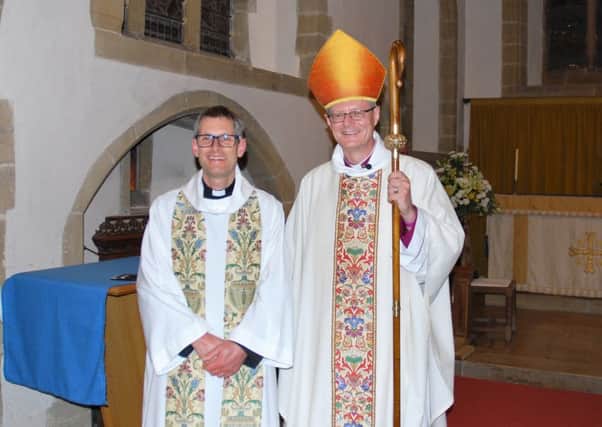 Bishop Mark Sowerby with Father Christopher Powell, at his service of induction at vicar of the Parish of St Peter and St John the Baptist Wivelsfield - picture submitted by Wivelsfield Parish Church