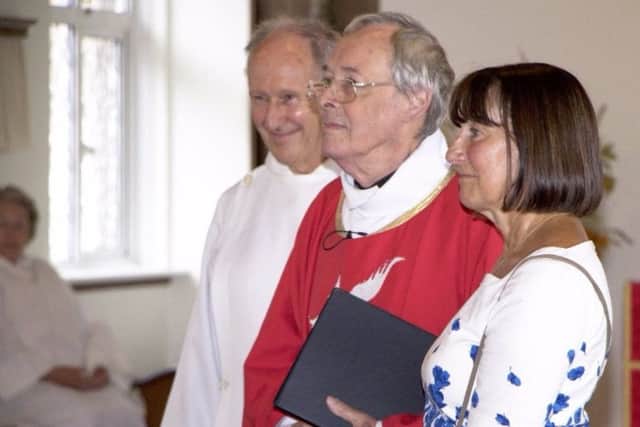 The Rev David Burt with local wardens Ruth Jepson and Geoff Oliver