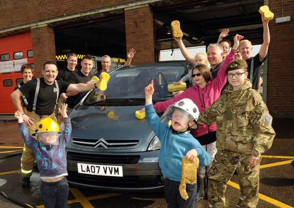 Firefighters will be cleaning cars for charity on Saturday
