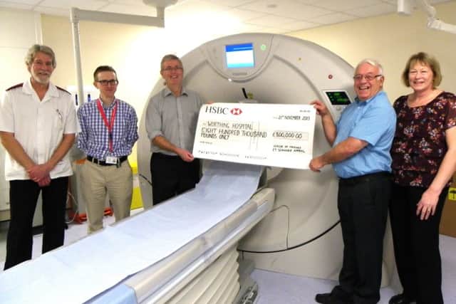 The Friends' chairman presents a cheque for Â£800,000 for a CT scanner