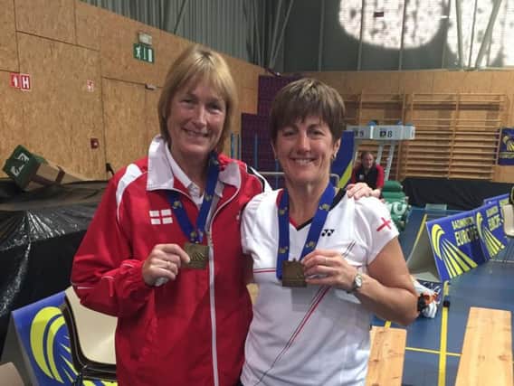Cathy Bargh (left) and Kay Vickers with their women's doubles gold medals.