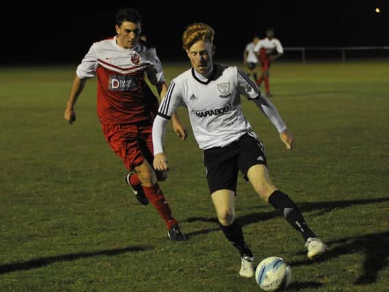 Wayne Giles on the ball against Seaford Town on Tuesday night. Picture by Simon Newstead