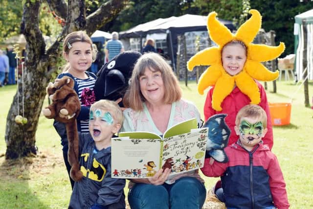 Author Julia Donaldson reads her book, A Treasury of Songs, with, from left, Jessica Brown, eight, Hector Bavin, three, Grace Jouanides, seven, and Archie Dempster, three 
LP1601002