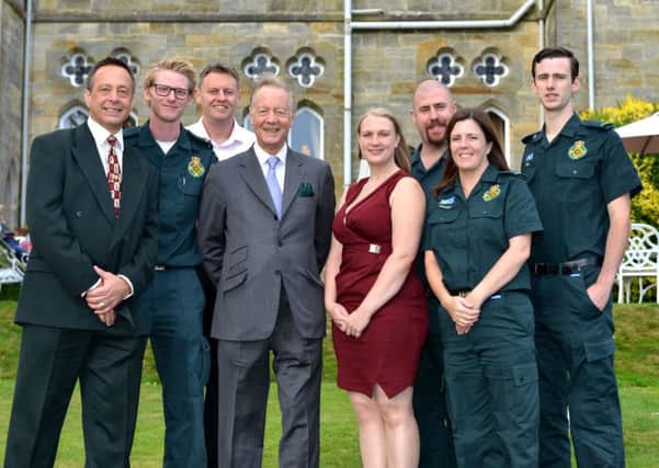 Sir Hugh Bennett and some of the staff who saved his life. Picture: SECAmbs