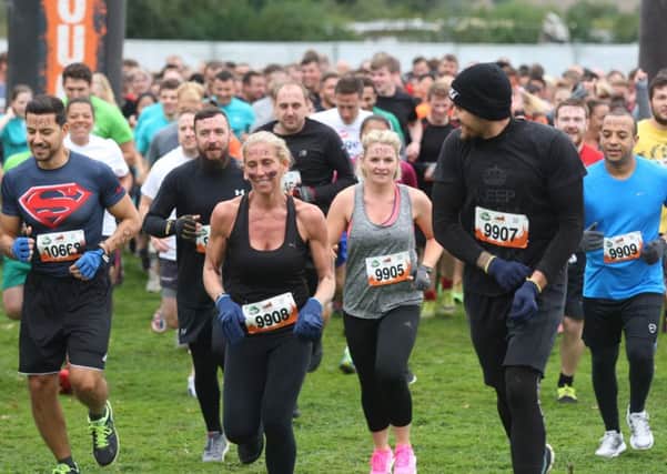 Twenty thousand people joined in the muddy fun at the Tough Mudder event