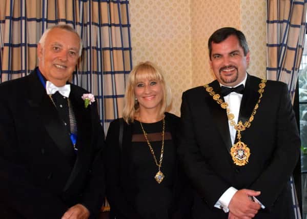Bexhill Lion's Club President Rick Hough, Bexhill Mayor Cllr Simon Elford and Mayoress Tanya Elford SUS-160410-101725001