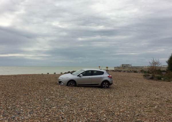 A car was left stranded on Worthing beach